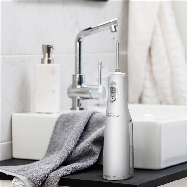 white-cordless-express-water-flosser-wf-02-in-bathroom. Waterpik Cordless Express Water Flosser WF02